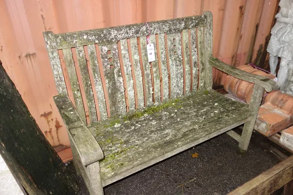 A 20th century teak garden bench.  OUT