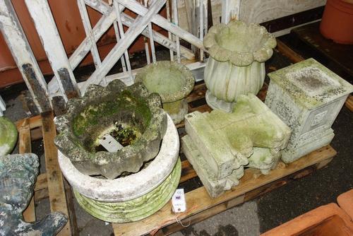 A wooden and reconstituted stone garden bench together with four garden stone pots and a plinth. (6)  OUT