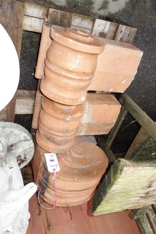 A pair of 20th century  terracotta corbels and another. (3)  OUT