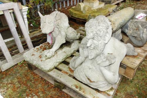 A reconstituted stone figure of a dragon and another of pan. (2)  OUT