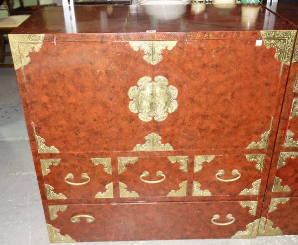 A 20th century Korean engraved brass red lacquered side cabinet with pair of cupboards over four various shelves, 92cm wide    DIS