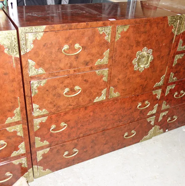 A 20th century Korean engraved brass red lacquered chest of three various drawers over two long drawers, 92cm wide.  DIS