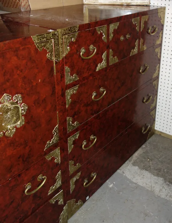 A 20th century Korean engraved brass red lacquered chest of three short over three long drawers, 92cm wide.    DIS