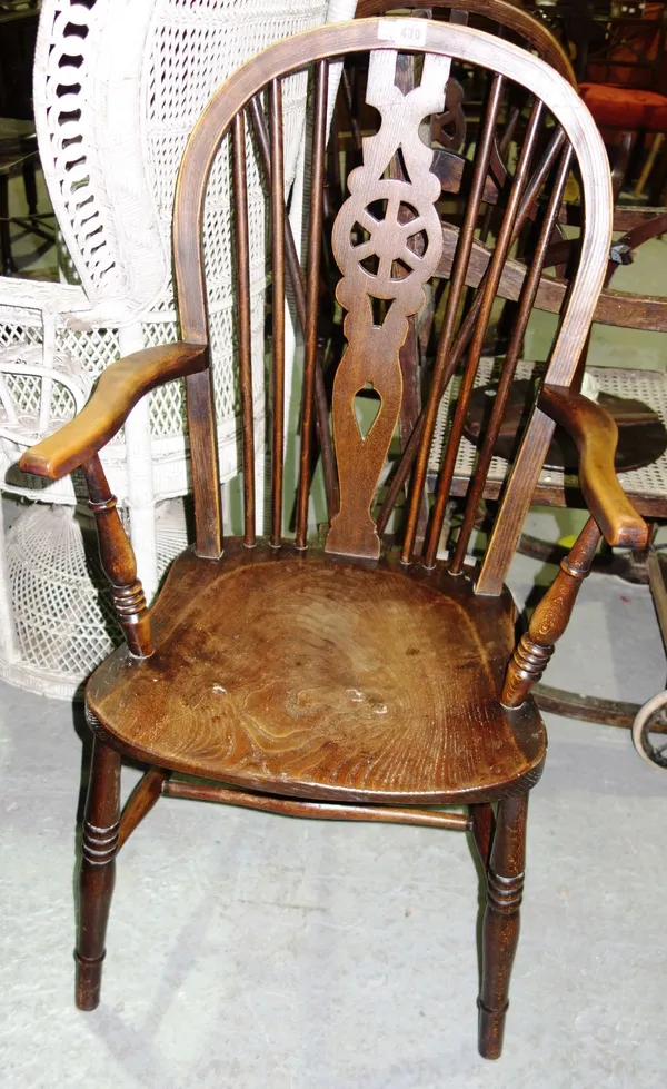 A pair of early 20th century ash and elm wheel back open armchairs, on turned supports (2).   D5