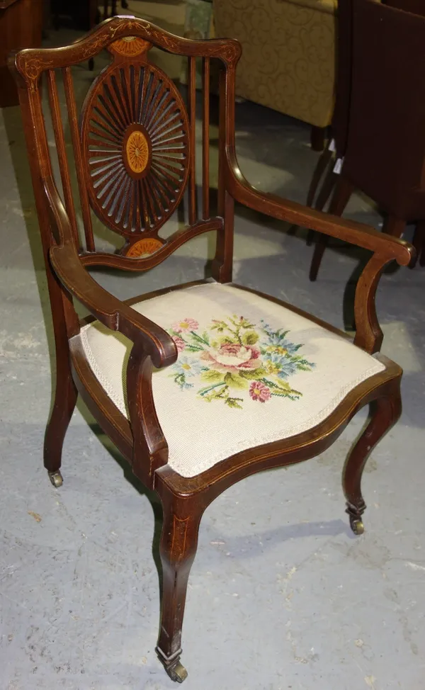 An Edwardian inlaid mahogany open armchair, with serpentine seat, on cabriole supports.  G4