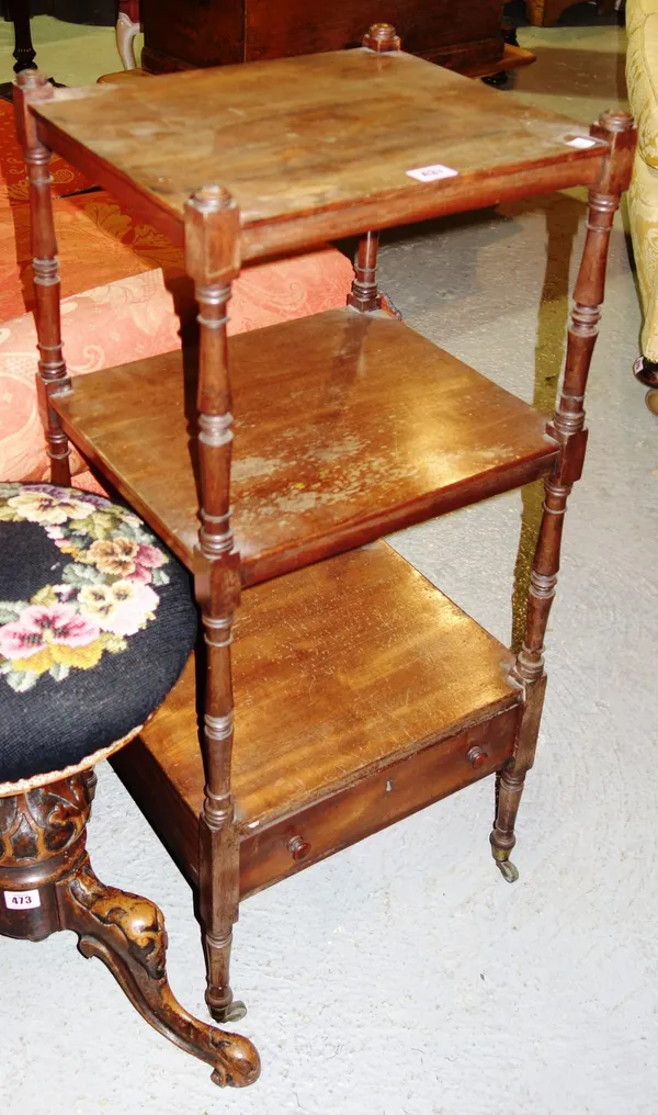 A small Victorian mahogany three-tier whatnot, the carved platform with single drawer, on turned supports, 38cm wide.  B3