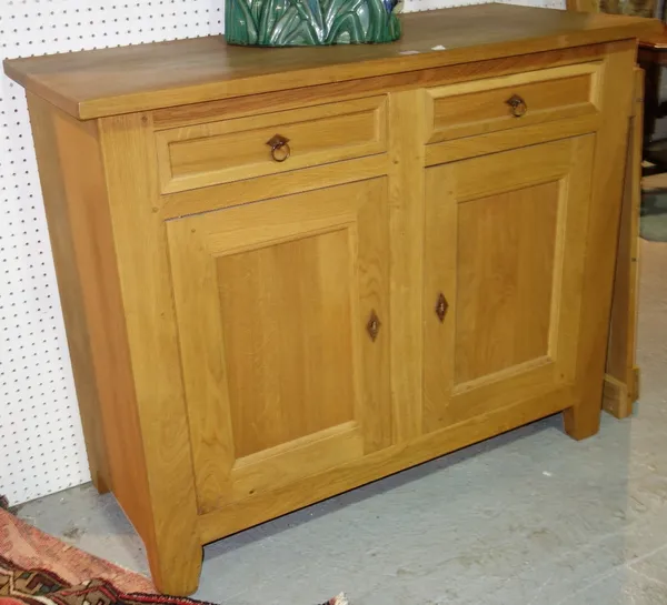 A 20th century light oak side cupboard with a pair of drawers and cupboards, 123cm wide. ROS