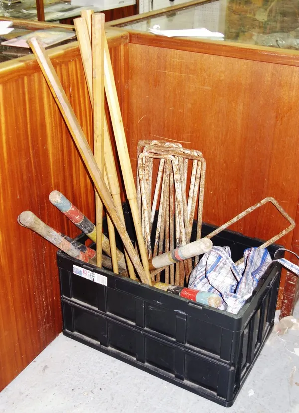 A croquet set, unboxed; including five mallets, hoops, balls and nine posts.  CAB