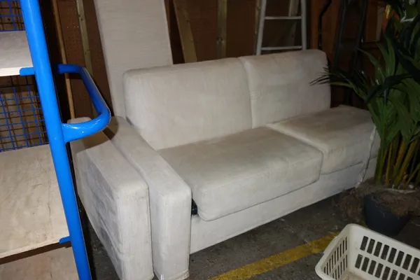 A 20th century cream upholstered sofa bed.  EXTRA