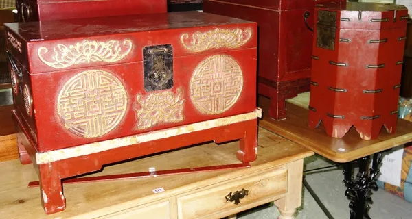 A 20th century Chinese red lacquer box on stand and an octagonal lift top box. (2)  GAL