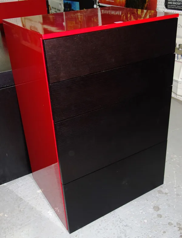 A 20th century black and red chest of four drawers together with a two door wall cabinet. (2)  GAL