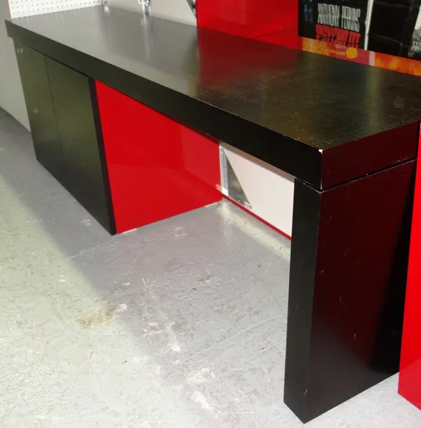 A 20th century black and red low side unit with pair of cupboard doors.  GAL