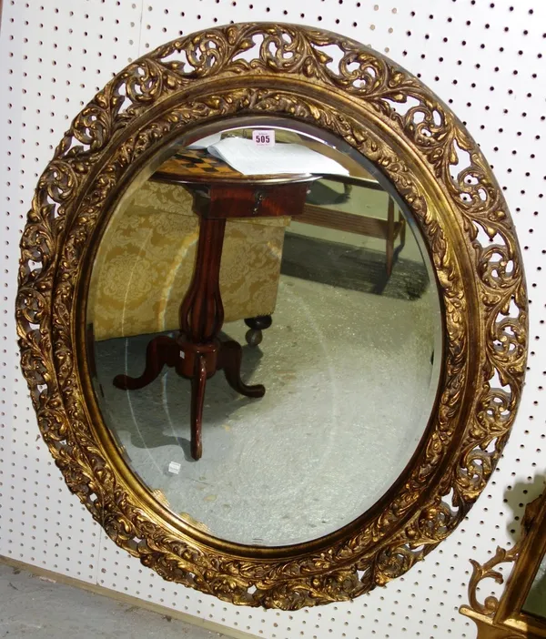 A 20th century oval gilt framed wall mirror with bevelled plate, 86cm x 105cm.  A1