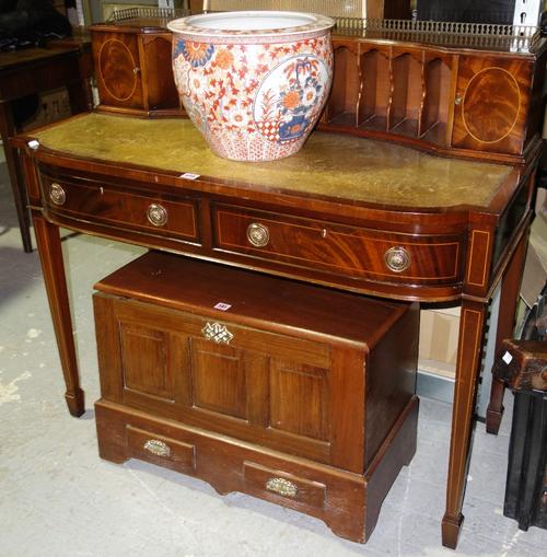 A 20th century mahogany writing table with gilt tooled green leather top on tapering square supports. H8