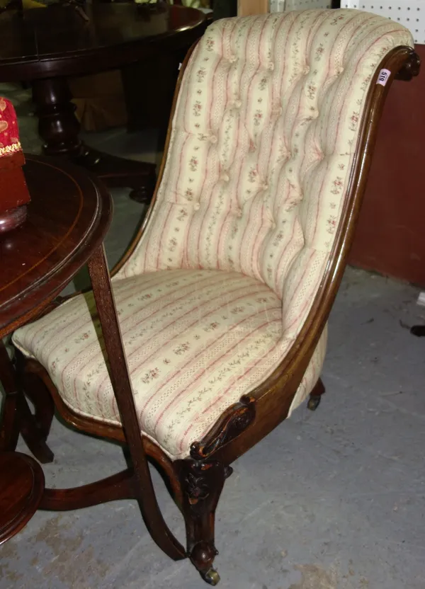 A 19th century mahogany button seated scroll back nursing chair.  G6