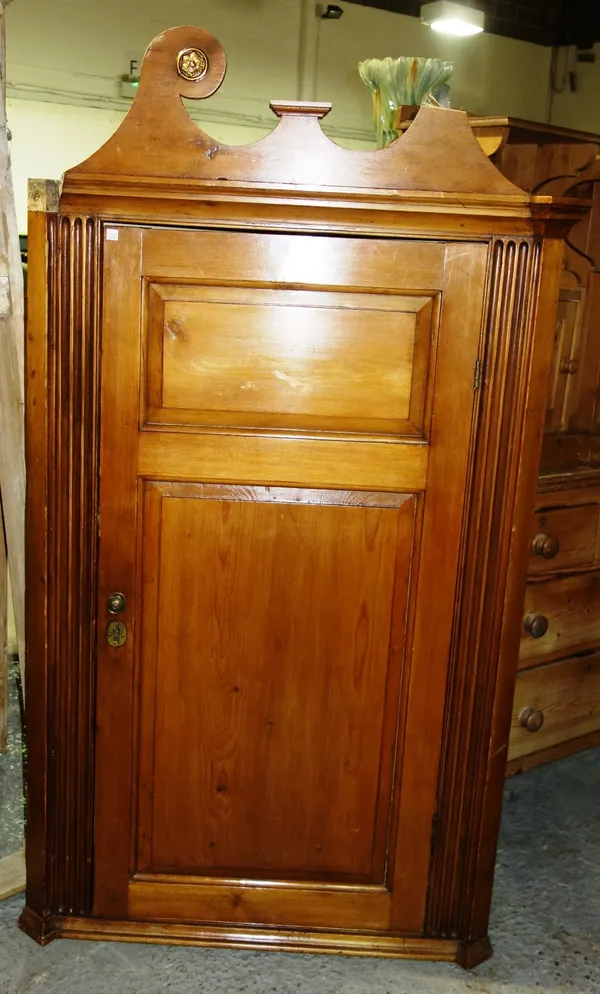 A 20th century pine floor standing corner cabinet, 87cm wide.   A4