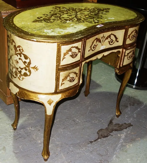 A 20th century kidney shaped gilt decorated dressing table, 92cm wide.   D5