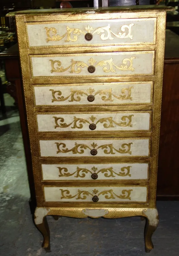 A 20th century tall chest of seven drawers, with gilt decoration, 64cm wide.  F5