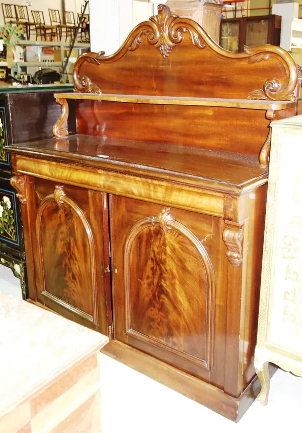 A Victorian mahogany shelf back chiffonier, with cushion drawer over cupboards, 133cm wide.  F5