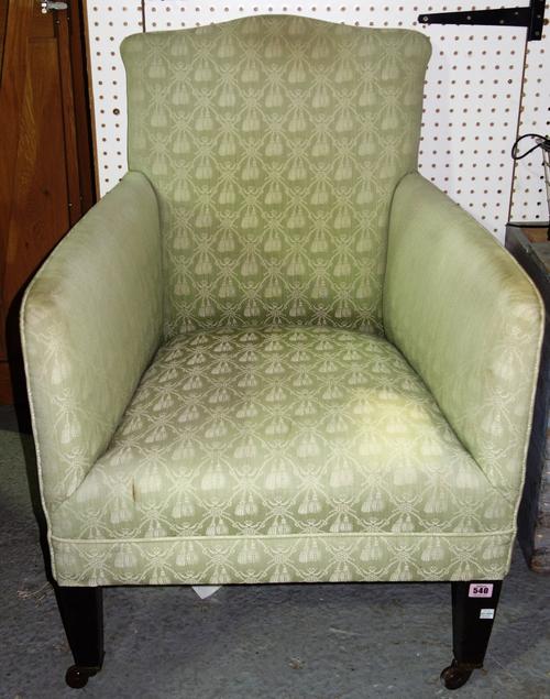 An Edwardian square back armchair, on block supports.  C8