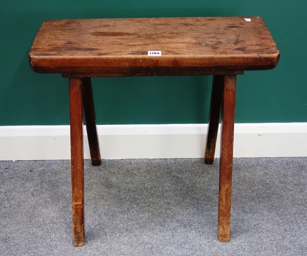 A George III pine coffin stool, the rectangular top on four splayed square supports, 60cm wide.  F3