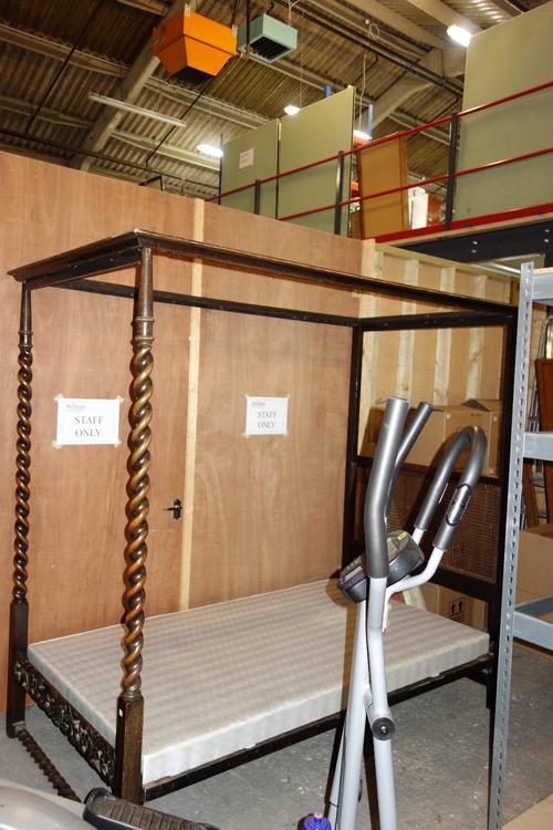 A 20th century four poster single bed.  EXTRA