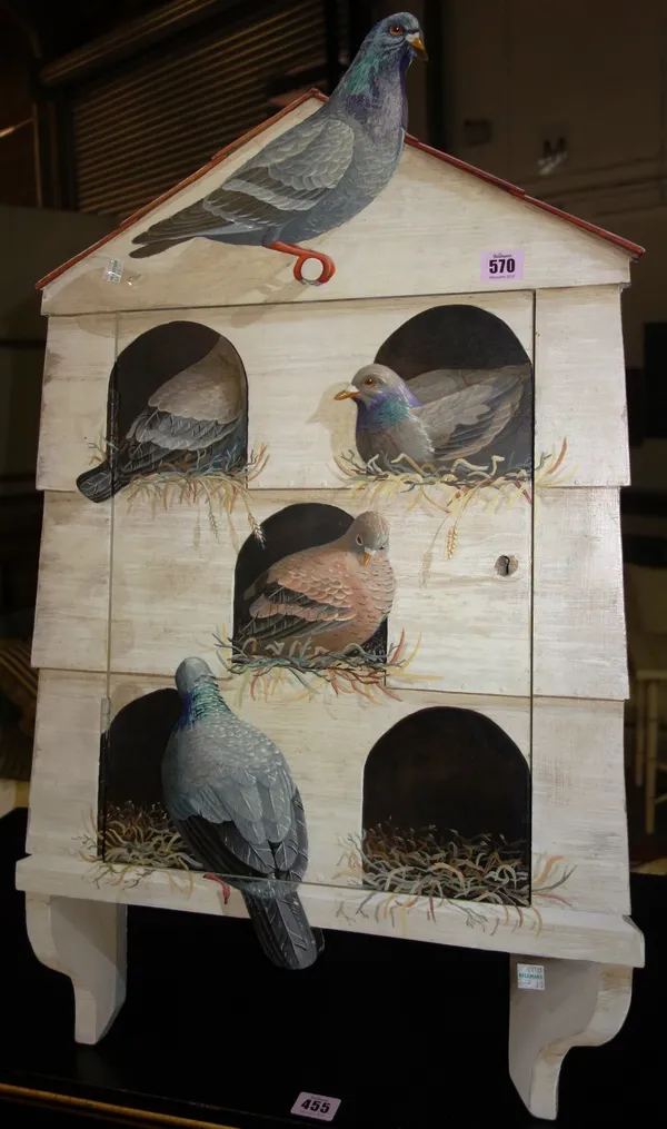 A 20th century painted corner cupboard in the form of a pigeon loft.  J3
