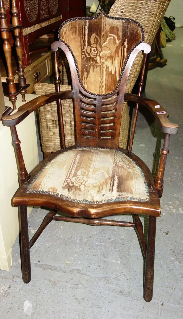 A 20th century walnut framed open armchair.  G7