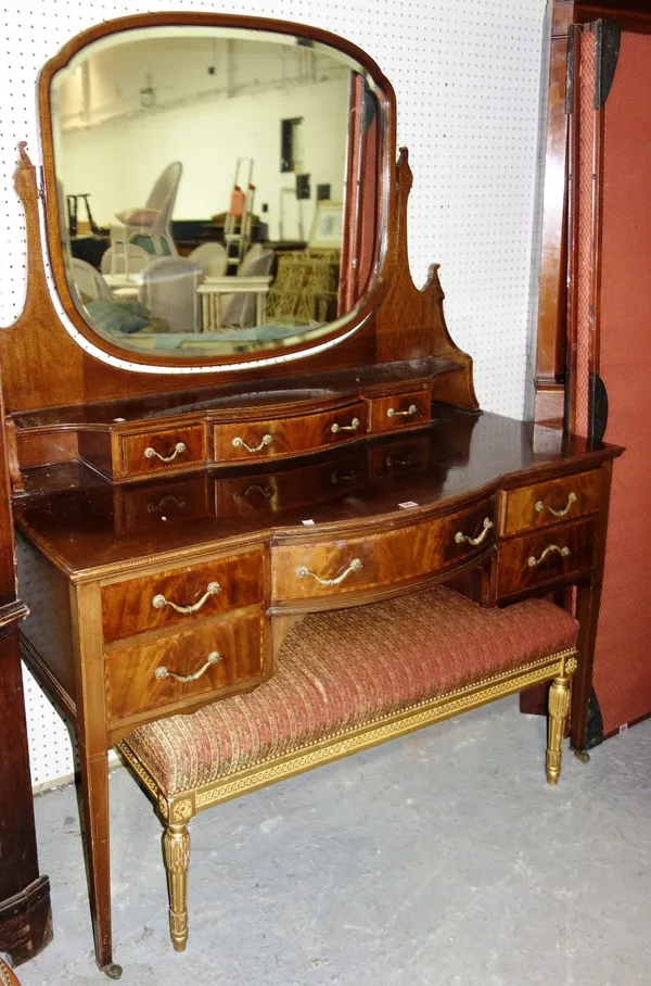 A large Edwardian mahogany and satinwood banded dressing table with retailers plaque 'P.E.Gane'.    M3