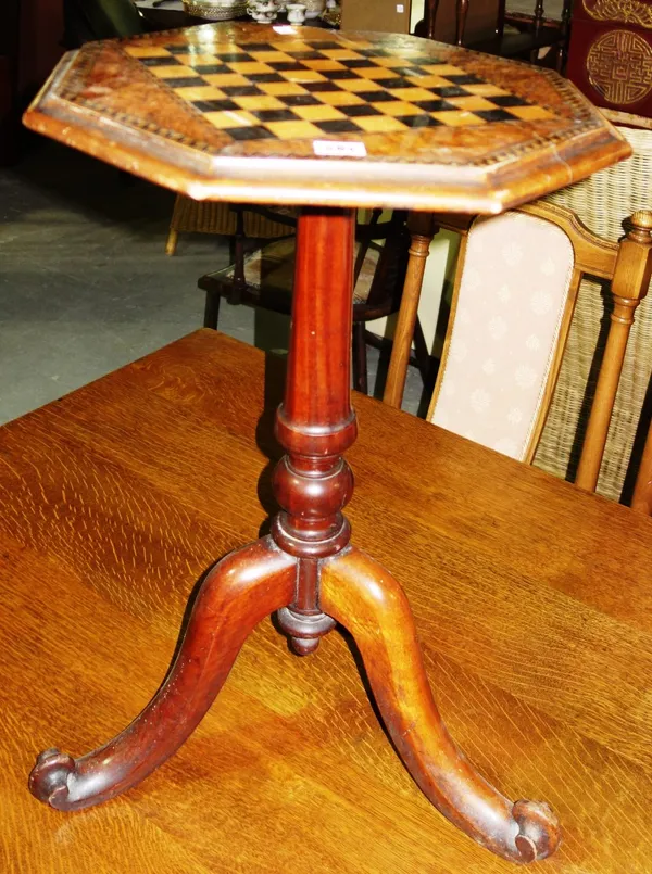 A 19th century walnut and inlaid chequer strung octagonal games table.  J8