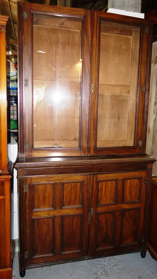 A 19th century mahogany bookcase cabinet with glazed upper section, 123cm wide. I6