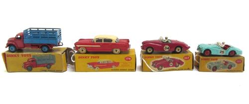Four Dinky die-cast vehicles, comprising; farm produce wagon, 174 Hudson Hornet Sedan, 111 Triumph TR2 sports, and 107 Sunbeam Alpine sports, boxed or