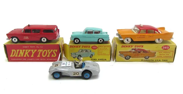 Four Dinky die-cast vehicles, comprising; 257 Canadian Fire Chief's car, 265 Plymouth USA taxi, and 155 Ford Anglia, all boxed, and a 110 Aston Martin