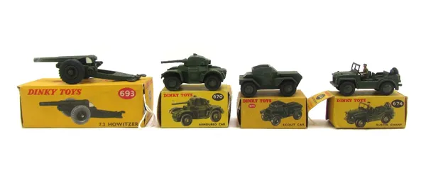 Four Dinky die-cast military vehicles, comprising; 670 armored car, 673 scour car, 674 Austin champ, and 693 7.2 Howitzer, all boxed (4).