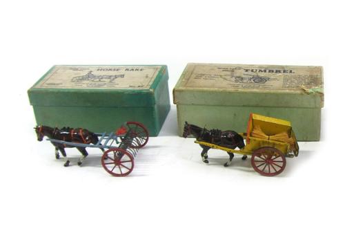 A Britains Horse Rake, no.8F, from the Home Farm series, and a Britains Tumbrel, no.4F, both boxed (2).