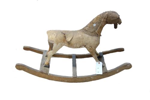 A wood and metal mounted child's velocipede/ tricycle horse, 19th century and two further wooden and hair covered toy horses, both 19th, one on a carv