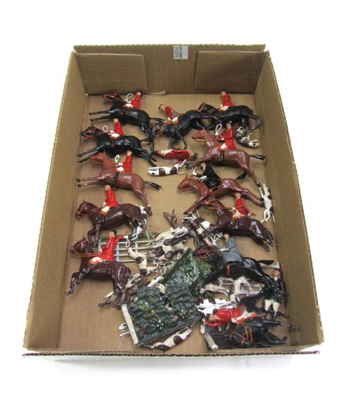 A quantity of Britains hollow cast lead figures, from the Hunting series, including mounted riders, hounds and a fox (qty).