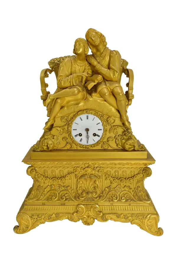 A Louis Phillipe gilt bronze mantel clock, surmounted with a courting couple seated over a white enamel dial and foliate cast case, on four outswept f