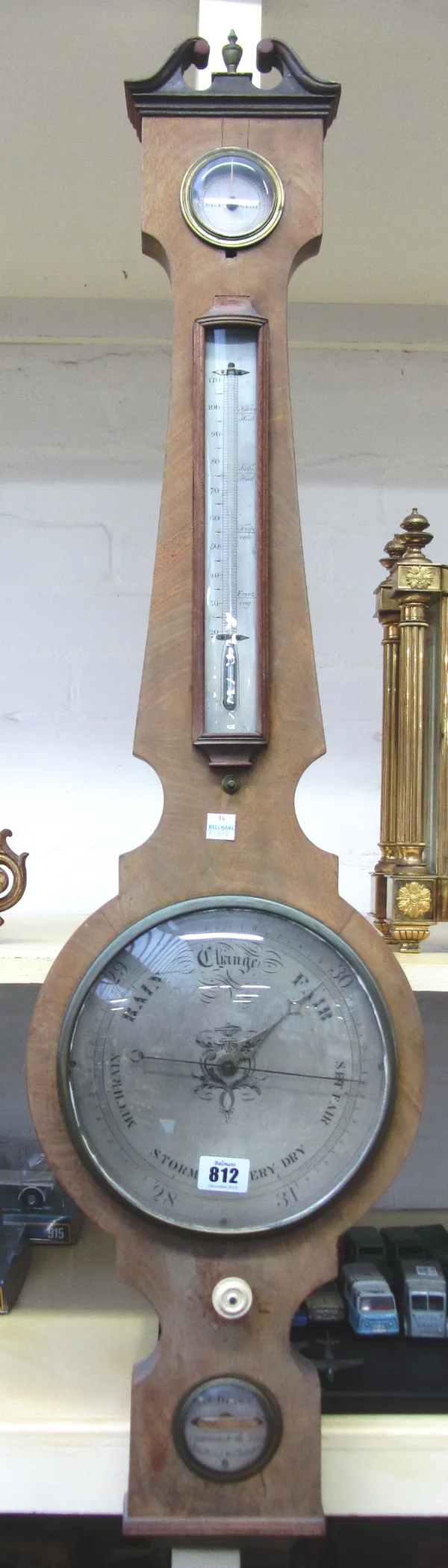 A George III mahogany cased wheel barometer with thermometer, by G&C Dixey, New Bond St, London, 101cm high.