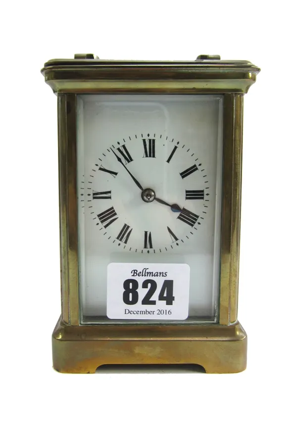 A French brass cased carriage clock, early 20th century, with white enamel dial, visible escapement and two train movement, with hammer striking a coi