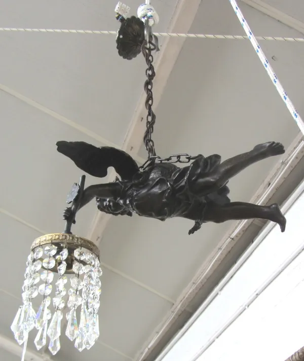 A patinated spelter figural ceiling light, early 20th century, modelled as a winged angel with crystal drops suspended from the light fitment, 30cm wi