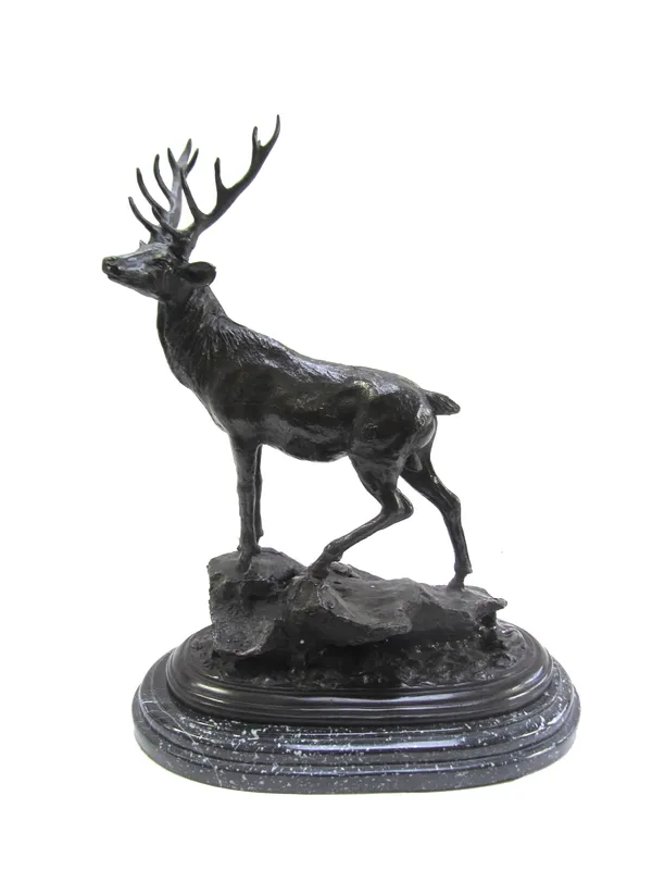 After Mene; a 20th century bronze 'Monarch of the Glen', depicting a stag atop a rocky outcrop and stepped marble base, 39cm high.