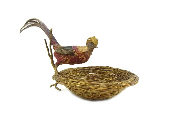 An Austrian cold painted bronze, early 20th century, depicting a golden pheasant perched above an empty nest, impressed number 18, 14cm high.Provenanc
