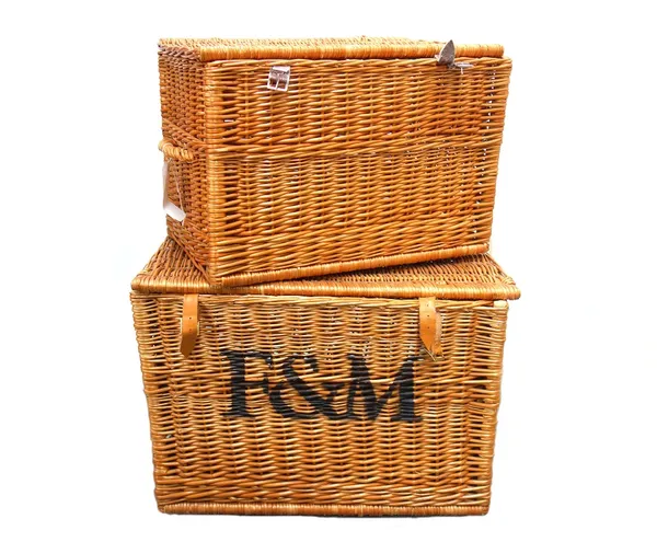 A Fortnum and Mason large wicker basket with twin handles and leather strapwork (70cm wide) and one smaller wicker basket. (2)Provenance; The Estate o