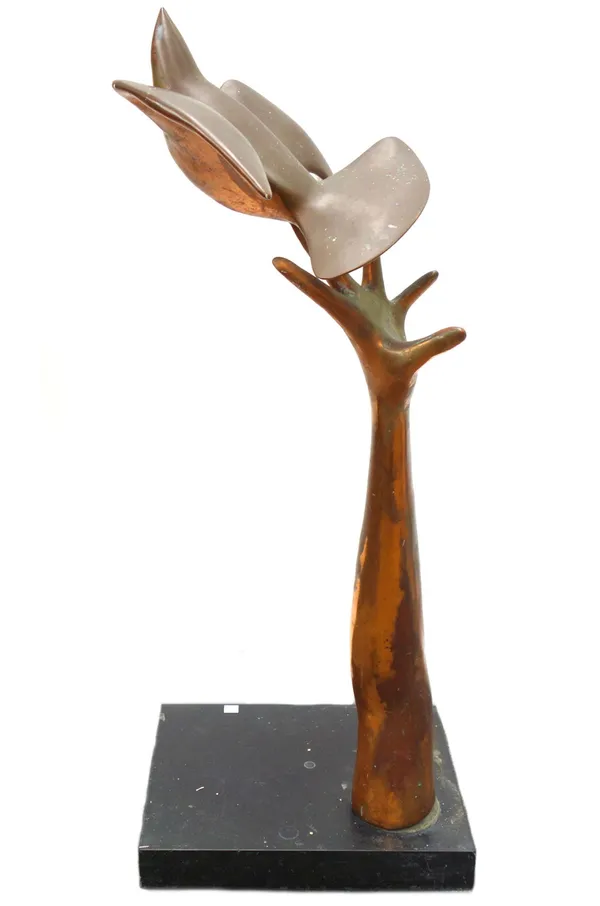 A copper sculpture, 20th century, modelled and cast as a hand releasing a dove, indistinctly signed and mounted on a polished black marble plinth, 88c