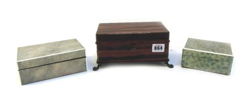 A Dunhill coromandel cigarette/cigar box, early 20th century, with a porcelain liner on bronze ball and claw feet, 18cm wide, together with two Art De