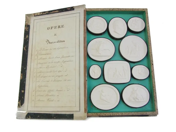 After Bertel Thorvaldsen, early 19th century, a group of plaster intaglios titled and presented in a vellum bound book.