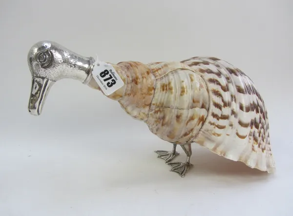 A white metal mounted nautilus shell depicting a duck (36cm wide) and a pair of Gucci gilt metal and leather 'Grouse' bookends, (3).Provenance; The Es
