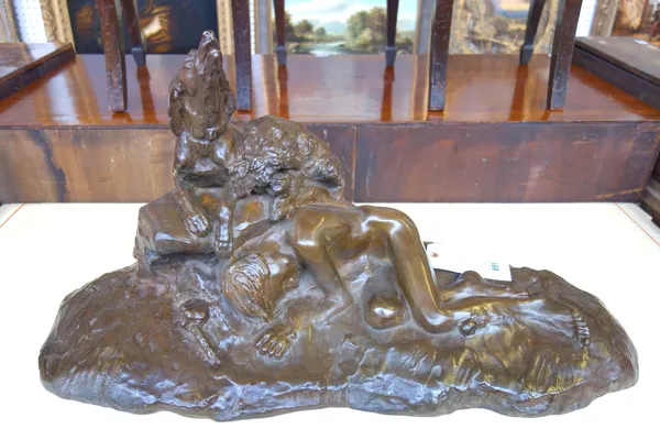 A French bronze group of a sleeping boy with two dogs, after Thomas Cartier, 1879-1943, C.1920, signed T.H.Cartier. 41cm high x 77cm wide.