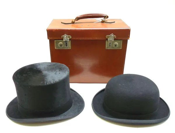 A brushed silk top hat by Woodrow Hunter & Co, in a leather case, and a gentleman's bowler hat by Cunningham & Co, size 7 1/4, (2).